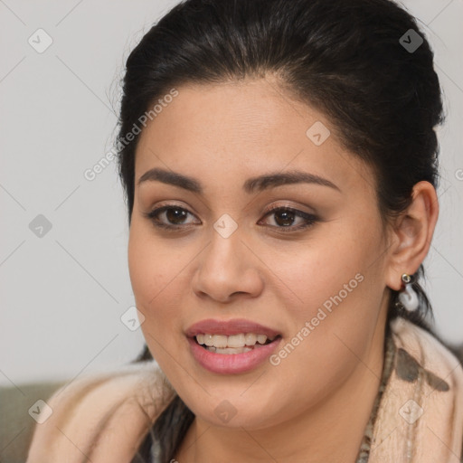 Joyful latino young-adult female with long  brown hair and brown eyes