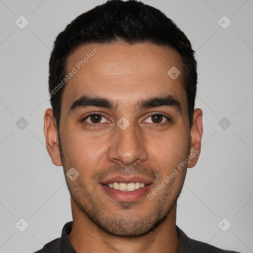 Joyful white young-adult male with short  black hair and brown eyes