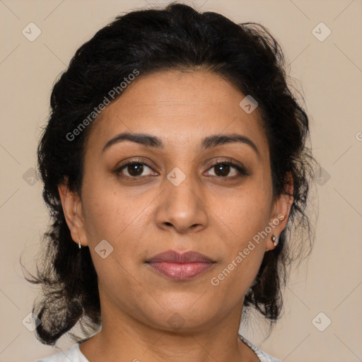 Joyful latino adult female with medium  brown hair and brown eyes