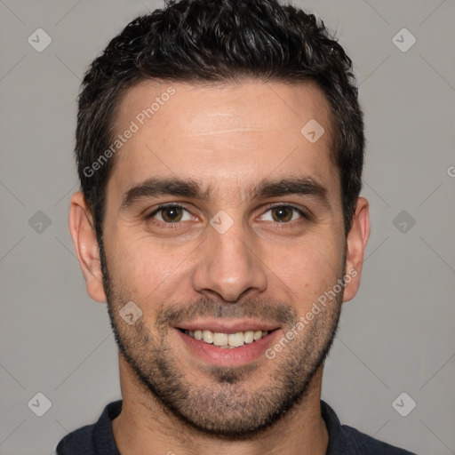 Joyful white young-adult male with short  black hair and brown eyes