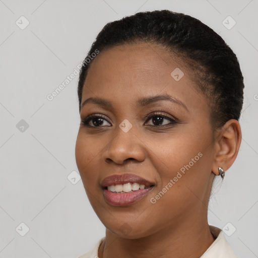 Joyful black young-adult female with short  brown hair and brown eyes