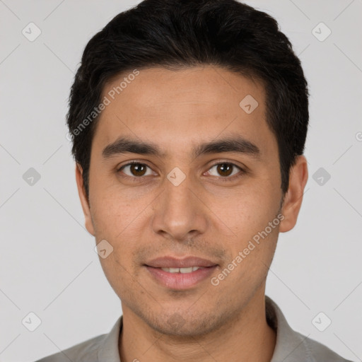 Joyful white young-adult male with short  black hair and brown eyes