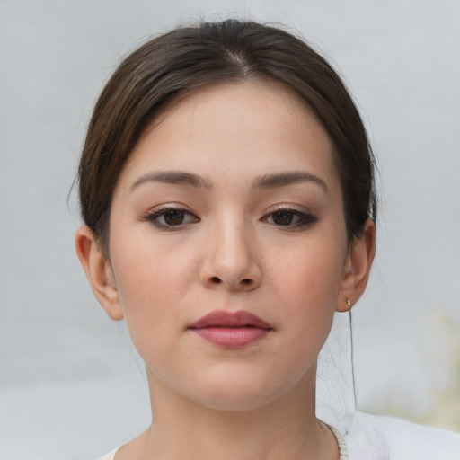 Neutral white young-adult female with short  brown hair and brown eyes