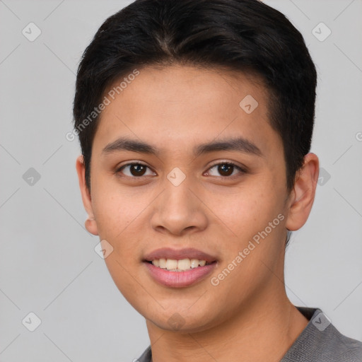 Joyful asian young-adult male with short  brown hair and brown eyes