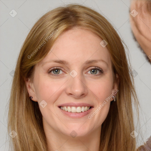 Joyful white adult female with long  brown hair and brown eyes