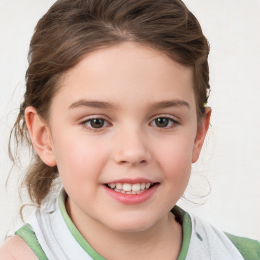 Joyful white child female with medium  brown hair and brown eyes