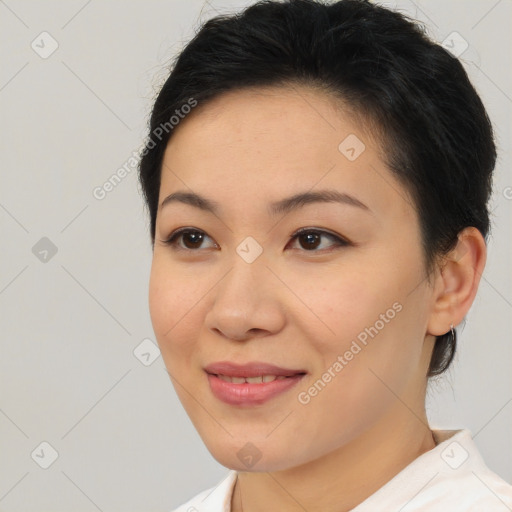 Joyful asian young-adult female with medium  brown hair and brown eyes