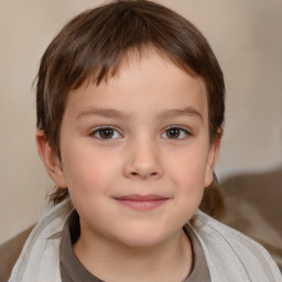 Joyful white child male with medium  brown hair and brown eyes