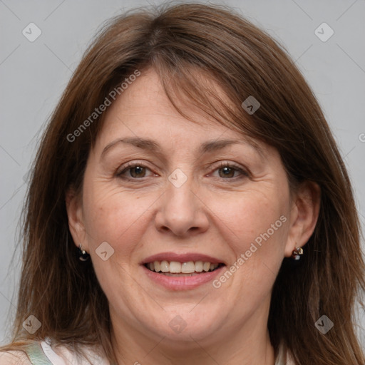 Joyful white adult female with medium  brown hair and grey eyes