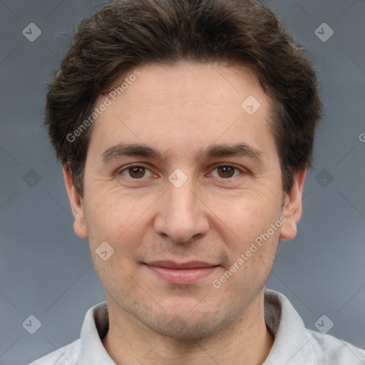 Joyful white adult male with short  brown hair and brown eyes