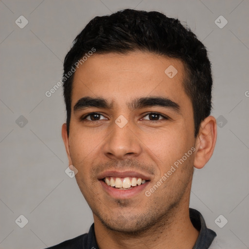 Joyful white young-adult male with short  black hair and brown eyes