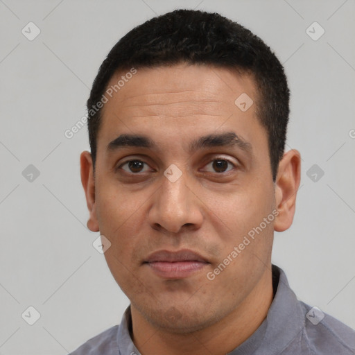 Joyful white adult male with short  black hair and brown eyes