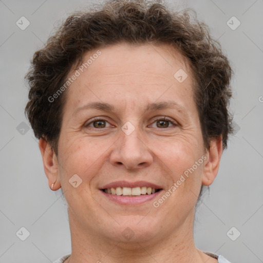 Joyful white adult female with short  brown hair and brown eyes