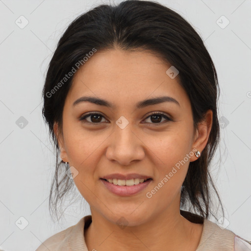 Joyful latino young-adult female with medium  brown hair and brown eyes