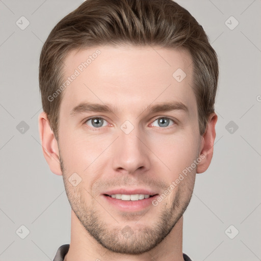 Joyful white young-adult male with short  brown hair and grey eyes