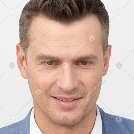 Joyful white adult male with short  brown hair and brown eyes