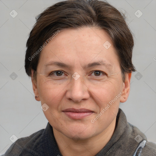 Joyful white adult female with short  brown hair and grey eyes