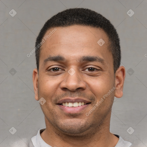 Joyful latino young-adult male with short  black hair and brown eyes