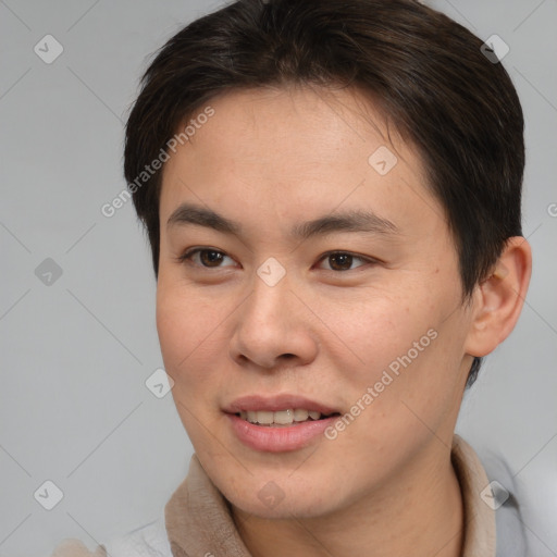 Joyful asian young-adult female with short  brown hair and brown eyes