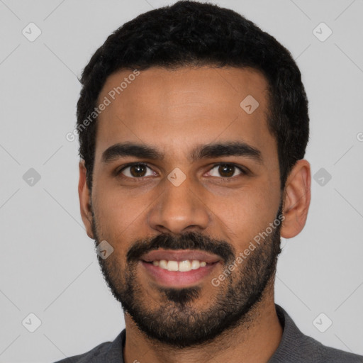 Joyful latino young-adult male with short  black hair and brown eyes