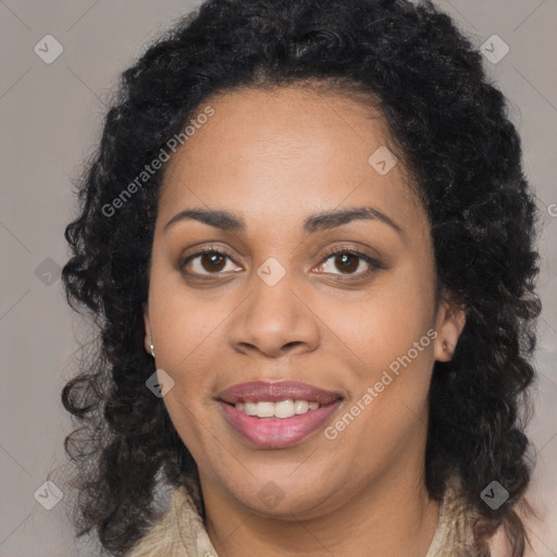 Joyful black young-adult female with long  brown hair and brown eyes