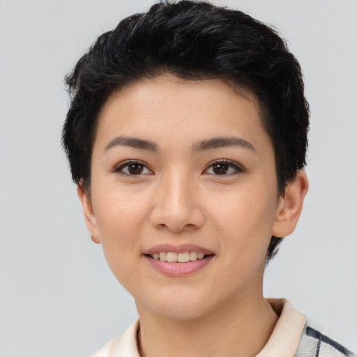 Joyful asian young-adult female with short  black hair and brown eyes