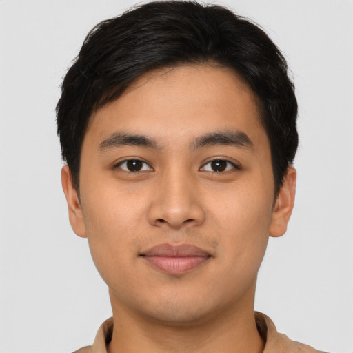 Joyful asian young-adult male with short  black hair and brown eyes