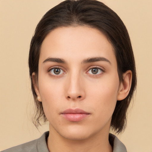 Neutral white young-adult female with medium  brown hair and brown eyes