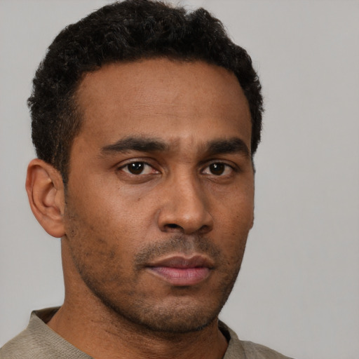 Neutral latino young-adult male with short  brown hair and brown eyes