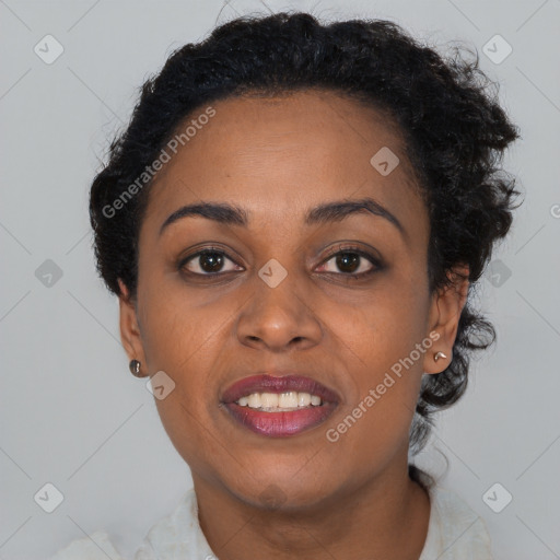 Joyful black young-adult female with short  brown hair and brown eyes