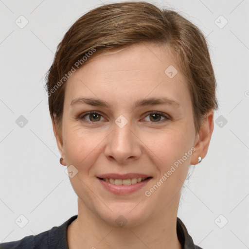 Joyful white young-adult female with short  brown hair and grey eyes