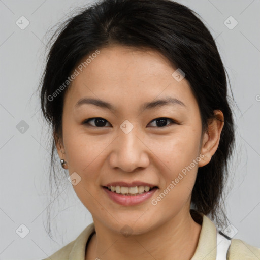 Joyful asian young-adult female with medium  brown hair and brown eyes