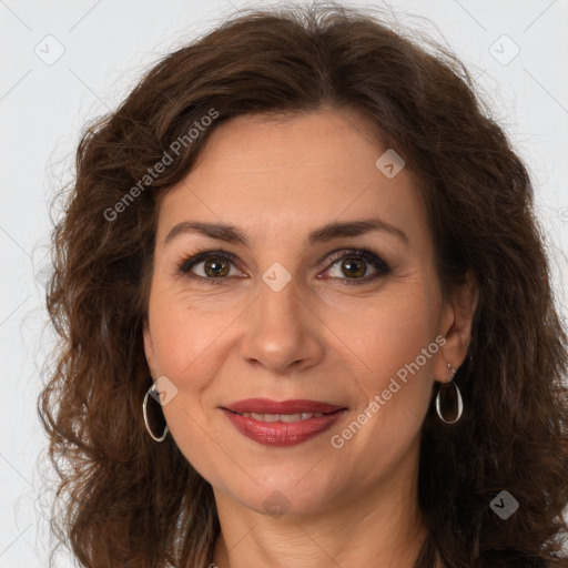 Joyful white adult female with long  brown hair and brown eyes