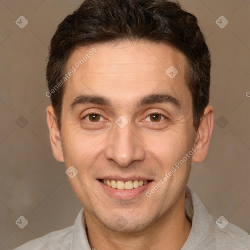 Joyful white adult male with short  brown hair and brown eyes