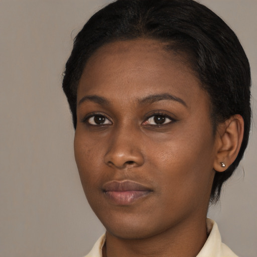 Neutral black young-adult female with short  brown hair and brown eyes