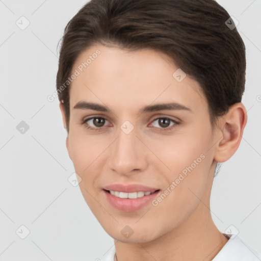 Joyful white young-adult female with short  brown hair and brown eyes