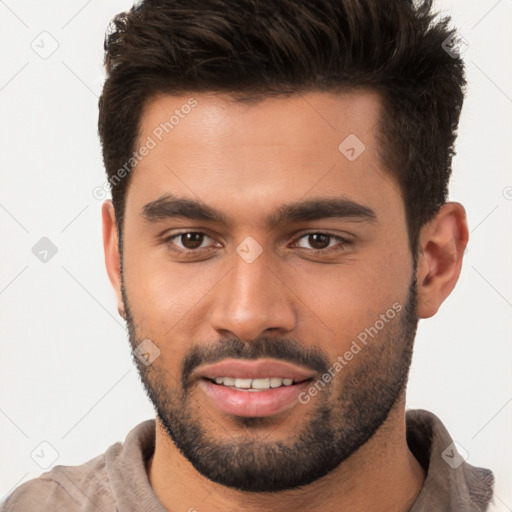 Joyful white young-adult male with short  brown hair and brown eyes