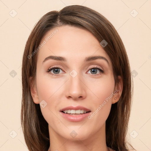 Joyful white young-adult female with long  brown hair and green eyes