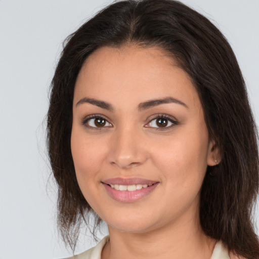 Joyful white young-adult female with medium  brown hair and brown eyes
