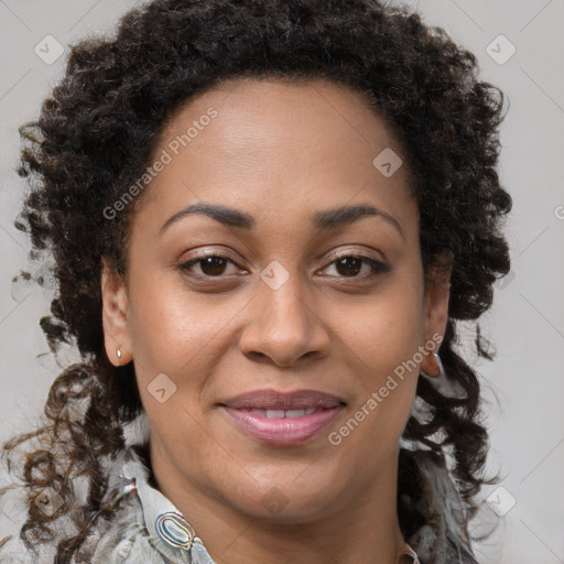 Joyful black adult female with medium  brown hair and brown eyes