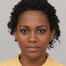 Neutral black young-adult female with short  brown hair and brown eyes