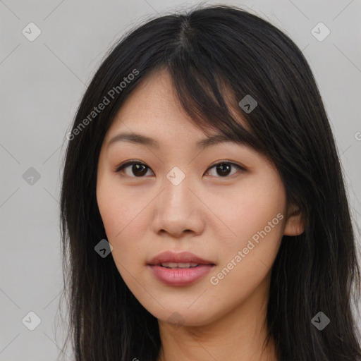 Joyful asian young-adult female with long  brown hair and brown eyes