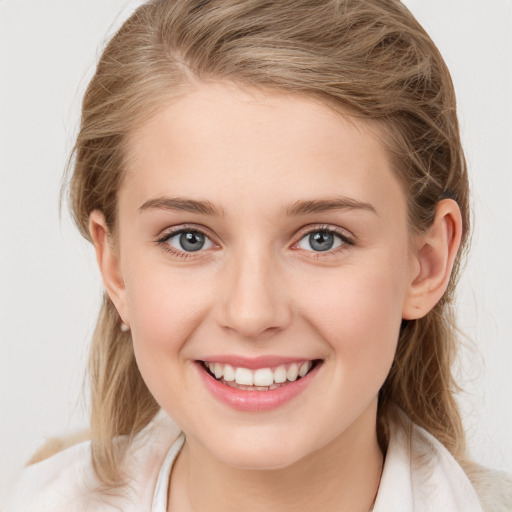 Joyful white young-adult female with medium  brown hair and blue eyes