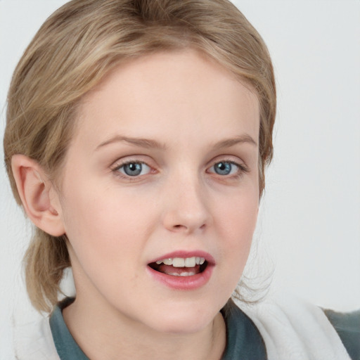 Joyful white young-adult female with medium  brown hair and blue eyes