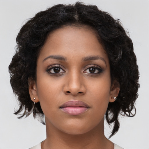 Neutral black young-adult female with long  brown hair and brown eyes