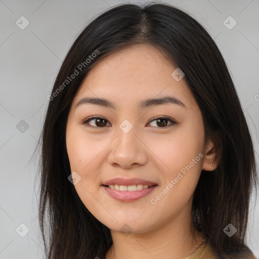 Joyful asian young-adult female with long  brown hair and brown eyes