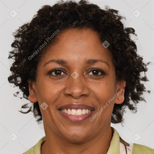 Joyful black adult female with short  brown hair and brown eyes