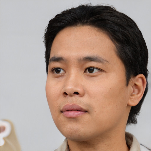 Neutral asian young-adult male with short  black hair and brown eyes