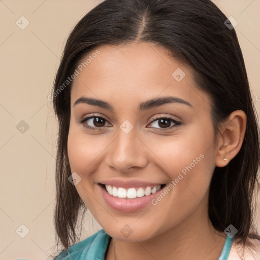 Joyful white young-adult female with long  brown hair and brown eyes