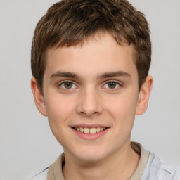 Joyful white child male with short  brown hair and brown eyes